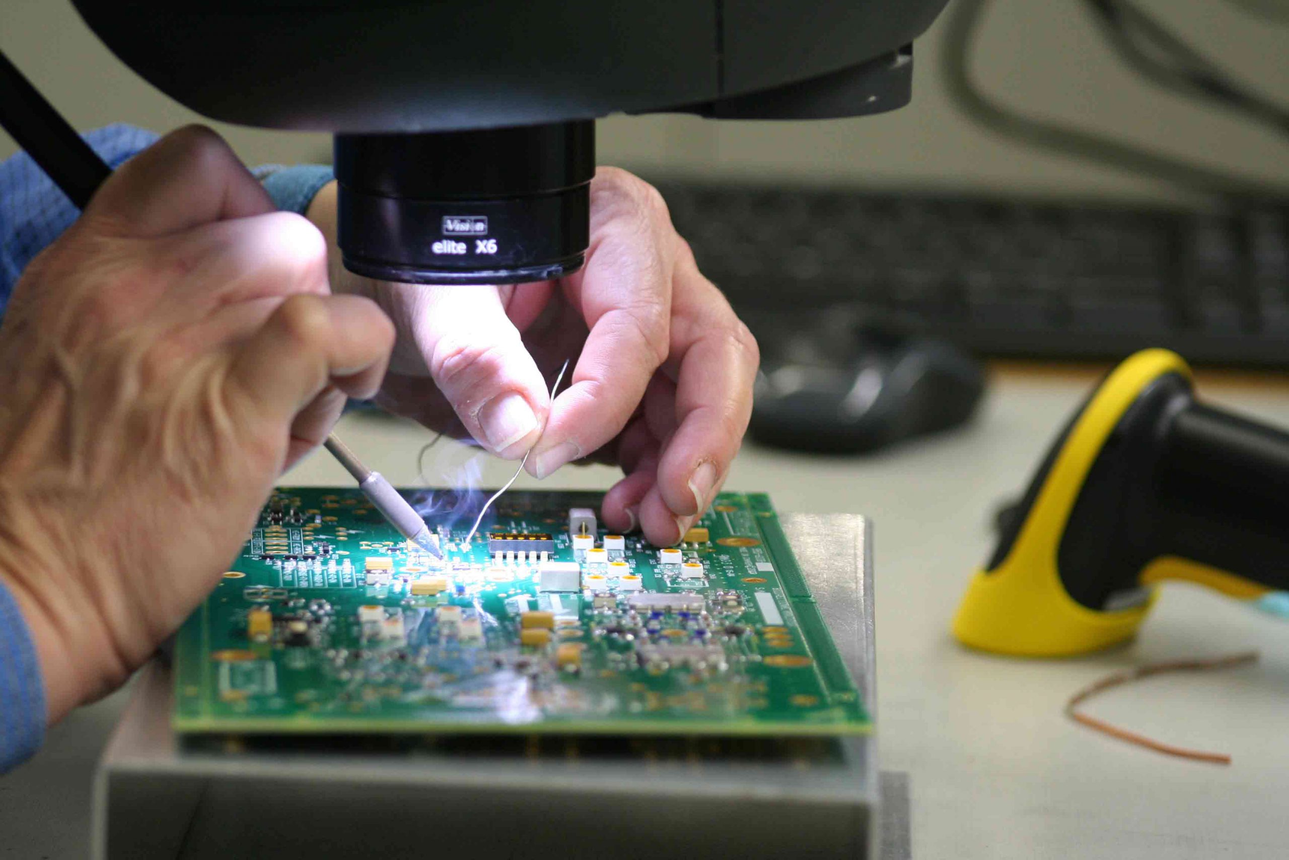 Photo of person soldering